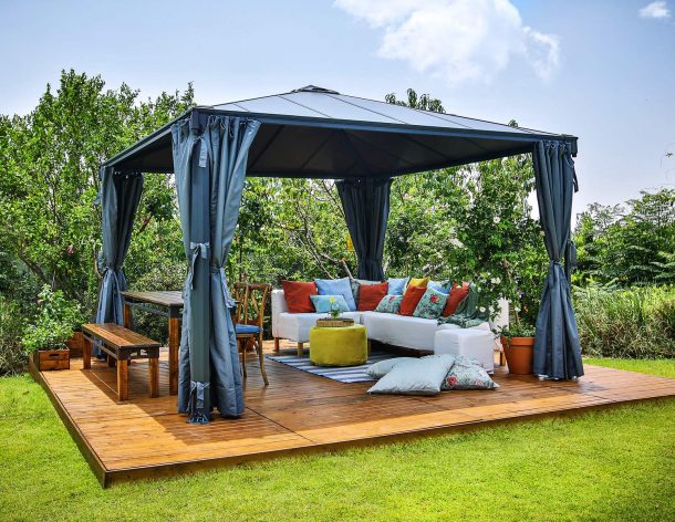 Palermo 3.6m x 3.6m grey garden gazebo with modern design, slanted roof, and polycarbonate panels in an outdoor setting