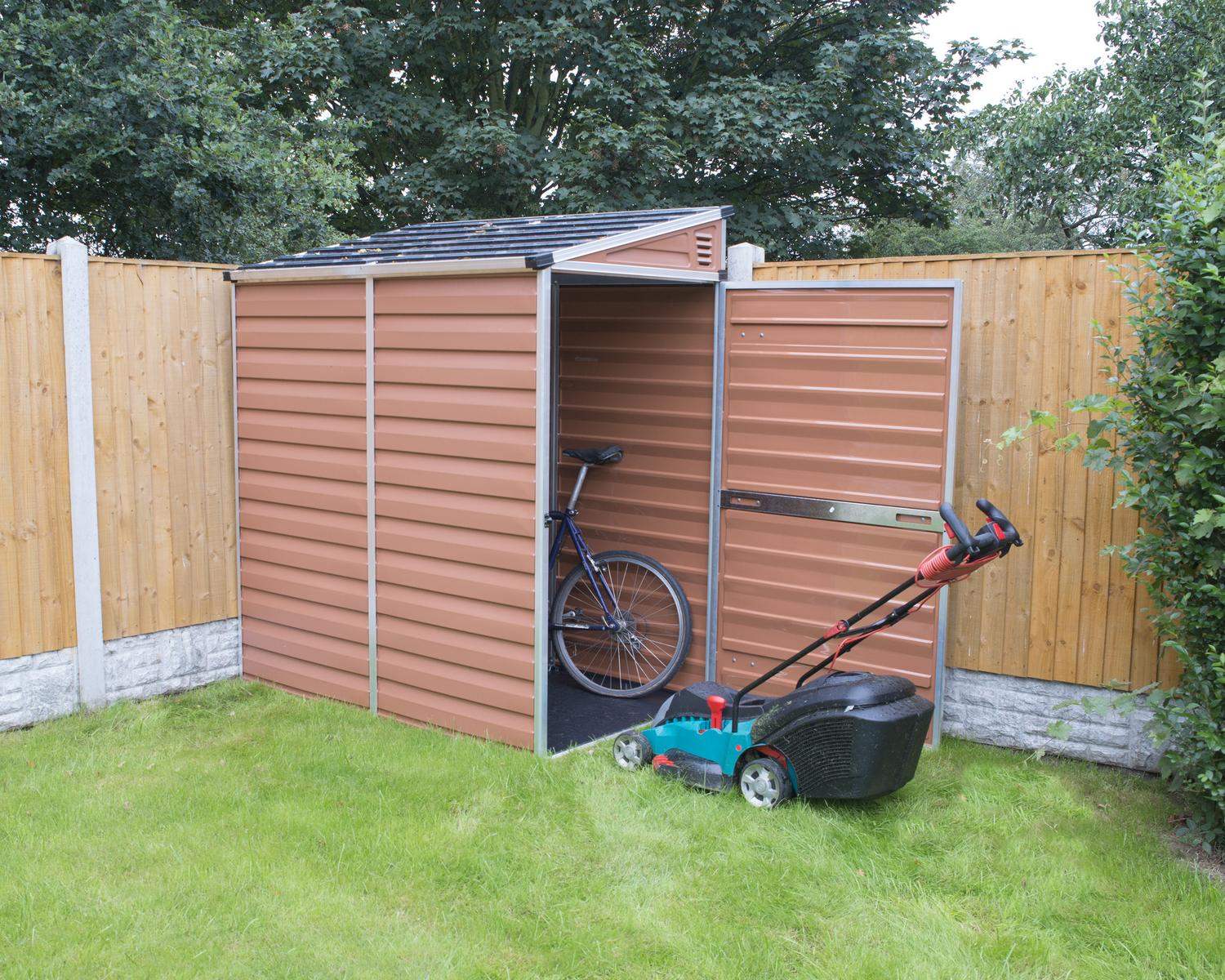 Modern Pent Amber 4ft. x 6ft. Garden Shed, aluminum frame and Polycarbonate Panels, in a garden next to a wooden fence