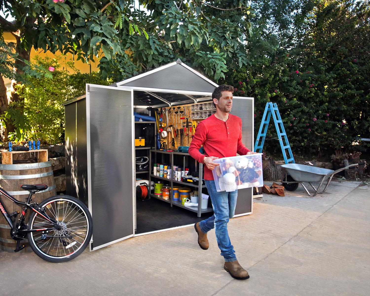 6ft x 8ft grey Rubicon garden shed with a sturdy aluminum frame, multiwall polycarbonate panels, and open doors revealing tools and shelves