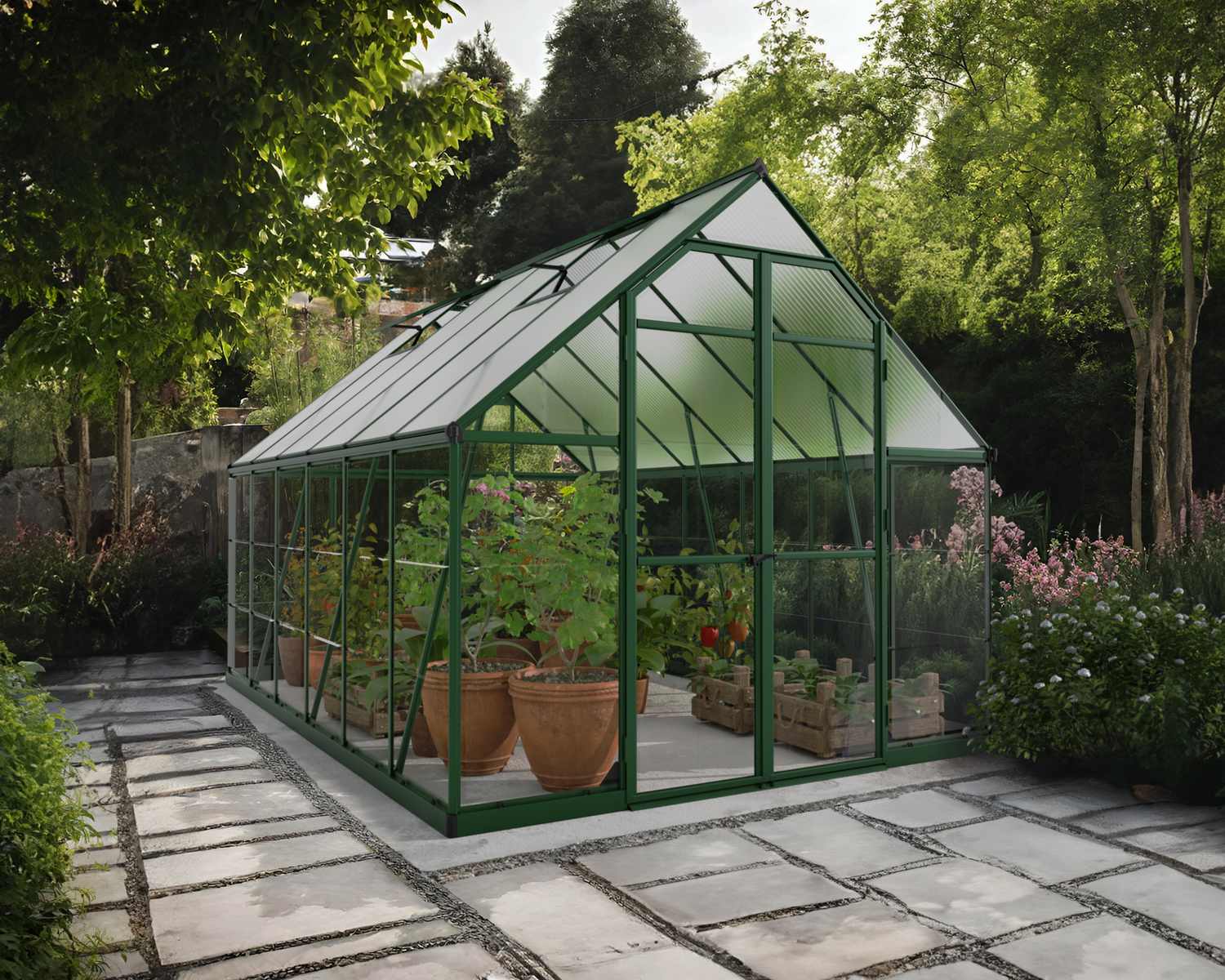 8ft x 12ft green Balance greenhouse with an aluminum frame, clear panels, plants, and a stone path in a tree-lined garden