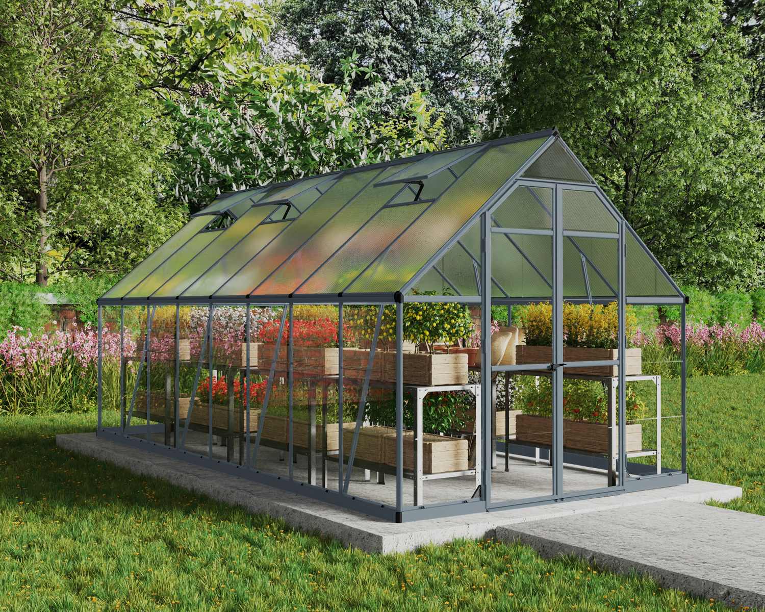 8ft x 16ft grey Balance greenhouse with an aluminum frame and clear polycarbonate panels, set in a garden with plants and a pathway