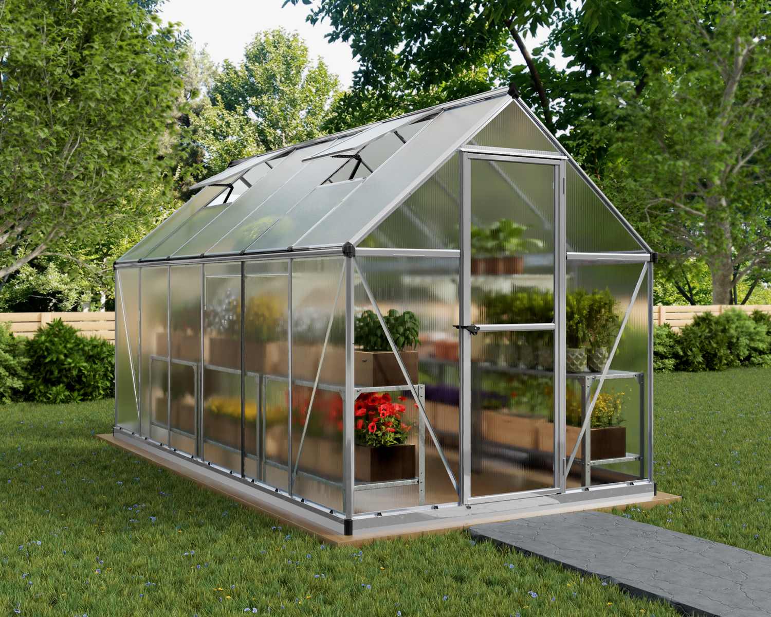 6ft x 12ft silver Mythos greenhouse with multi-wall polycarbonate panels and an aluminum frame, set in a garden environment