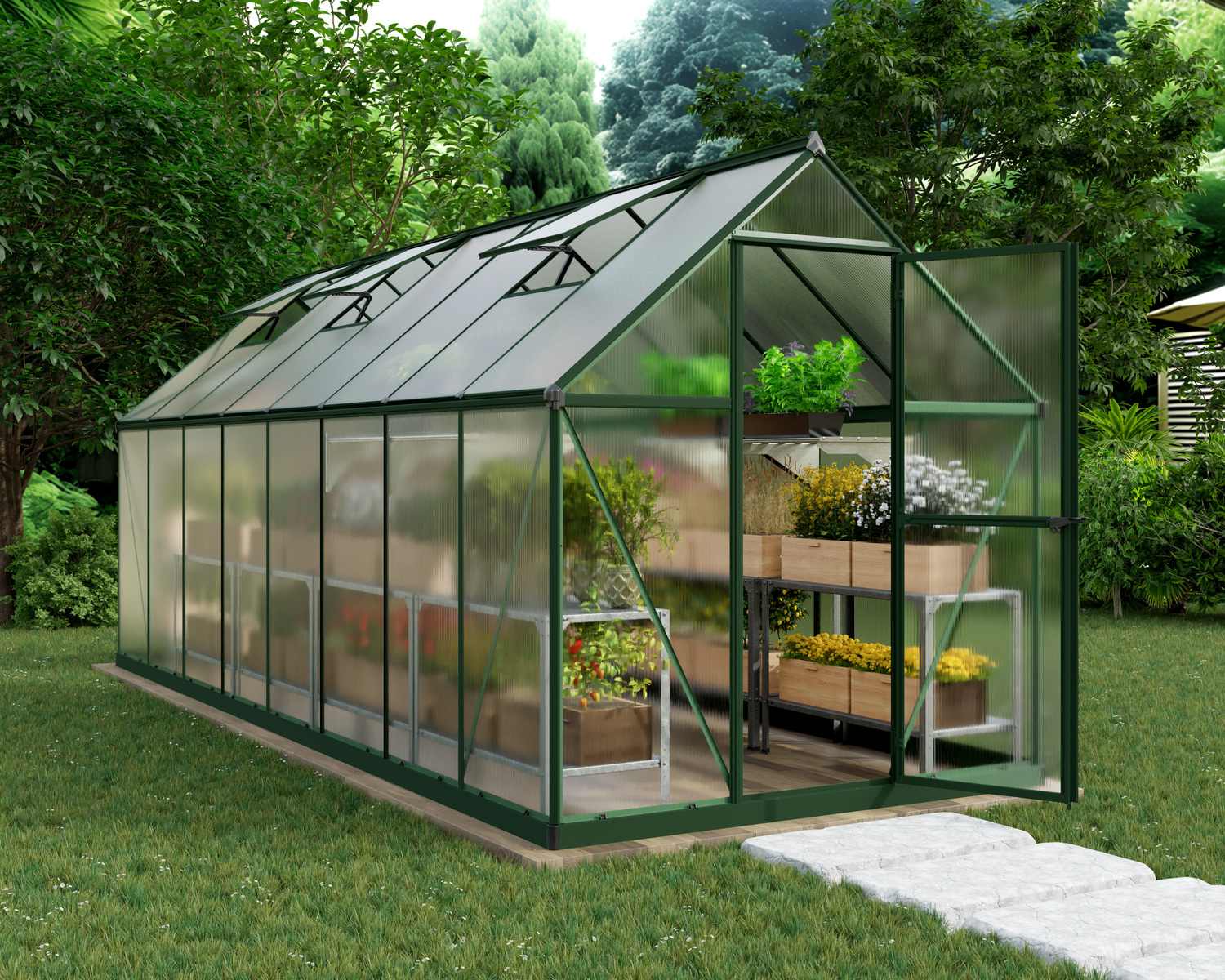 6ft x 14ft grey Mythos greenhouse with multi-wall polycarbonate panels, set in a lush garden with trees and a stone path