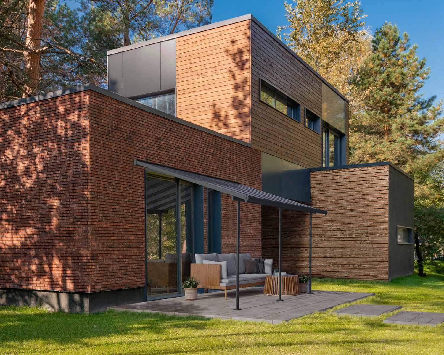 Grey Sierra patio cover, 3m x 4.3m, with an aluminum frame and clear polycarbonate panels for durable shade and weather protection