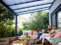 Grey Stockholm patio cover, 3.4m x 5.2m, with a durable aluminum frame and clear polycarbonate panels for reliable weather protection