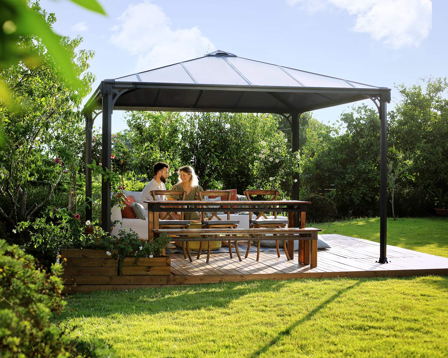 Palermo 3.6m x 3.6m grey garden gazebo with modern design, slanted roof, and polycarbonate panels in an outdoor setting
