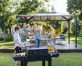 Family Playing With Bubbles In Garden in front of a 10'x14' aluminum gazebo with polycarbonate roof panels