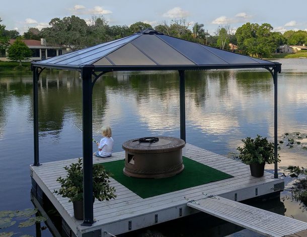 Palermo 12'x12' Aluminium gazebo with polycarbonate roof panels on patio deck above lake