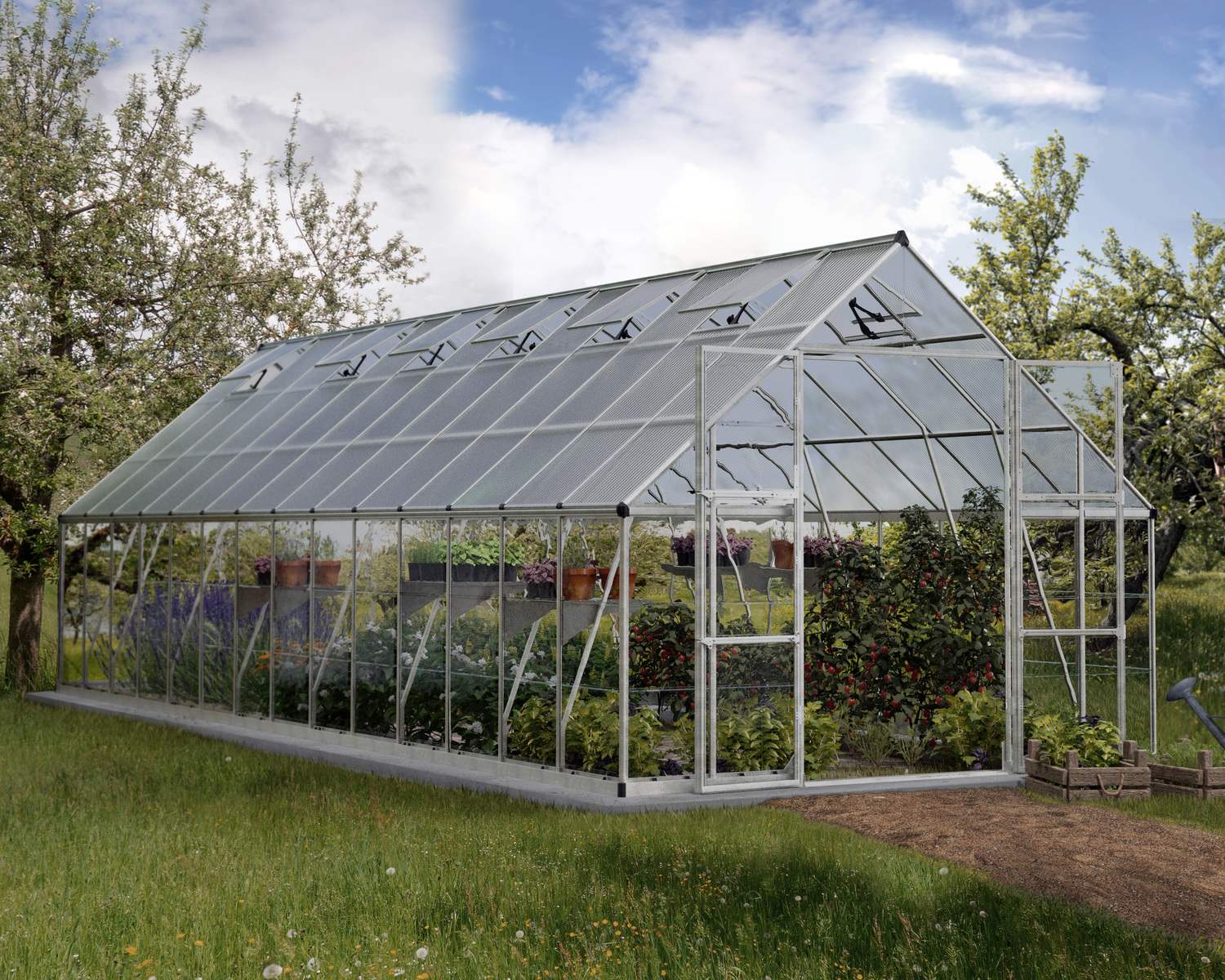 10ft x 28ft silver Balance greenhouse with an aluminum frame and clear polycarbonate panels, set in a garden