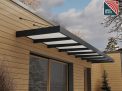 Sophia XL Grey 7.50m x 1.4m door canopy with white polycarbonate panels, offering sleek and reliable protection for large entryways