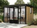 Stylish Copenhagen 3m x 3.5m black Lean to Conservatory with an aluminum frame and clear polycarbonate panels, set in a serene garden at sunset
