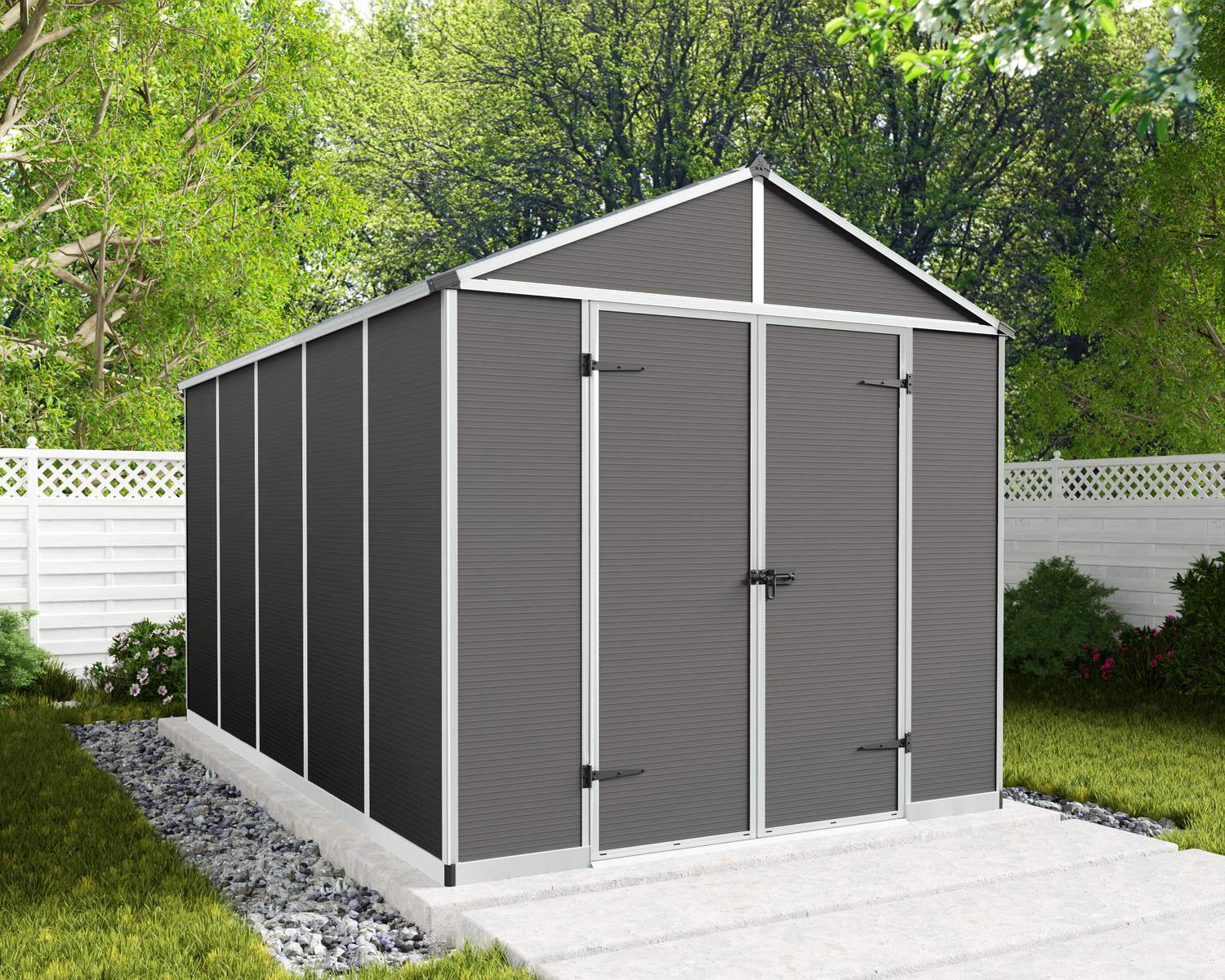 8ft x 12ft grey Rubicon garden shed with a sturdy aluminum frame and multiwall polycarbonate panels, surrounded by greenery and a white fence