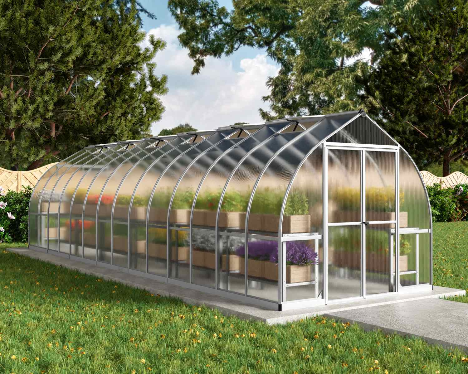 8ft x 28ft silver Bella greenhouse with a sleek aluminum frame and multi-wall polycarbonate panels, set in a garden