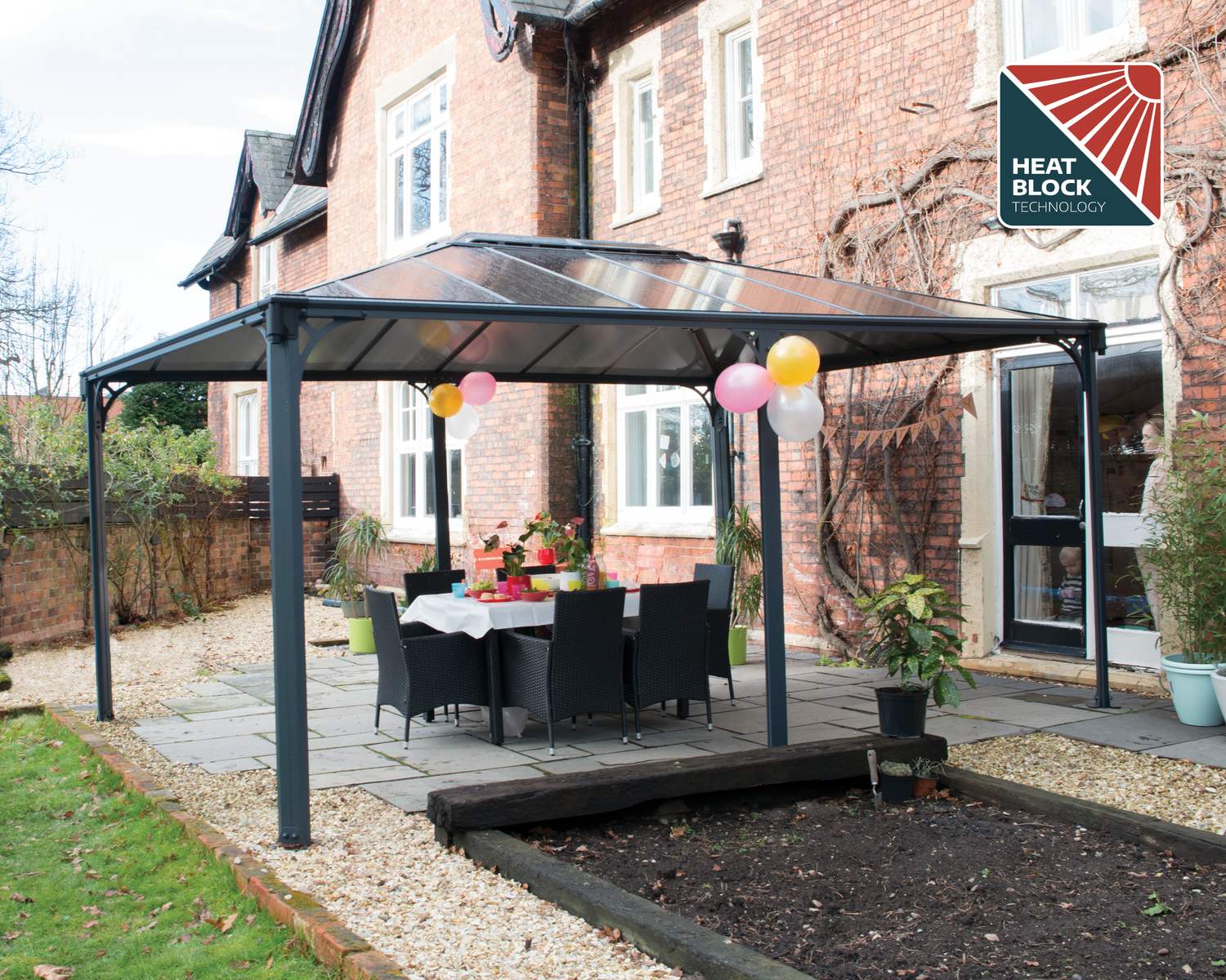 Martinique 3.6m x 5m grey garden gazebo with a sturdy aluminum frame and HeatBlock polycarbonate roof panels, offering spacious and stylish outdoor shelter
