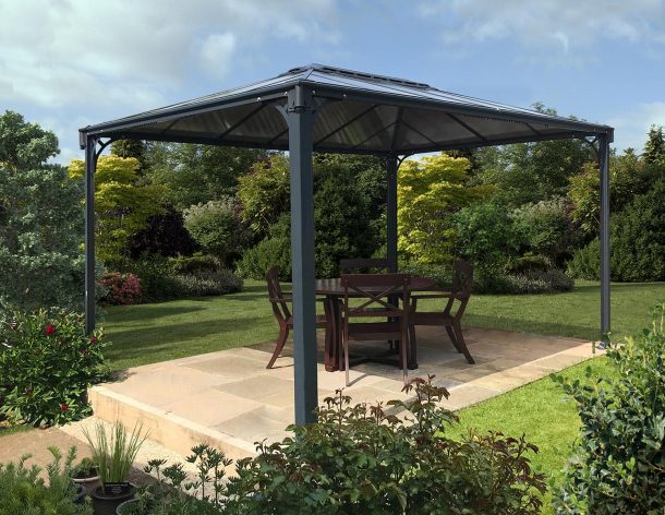 Martinique 10'x14' Garden gazebo grey aluminum with polycarbonate roof panels on a patio with dining furniture