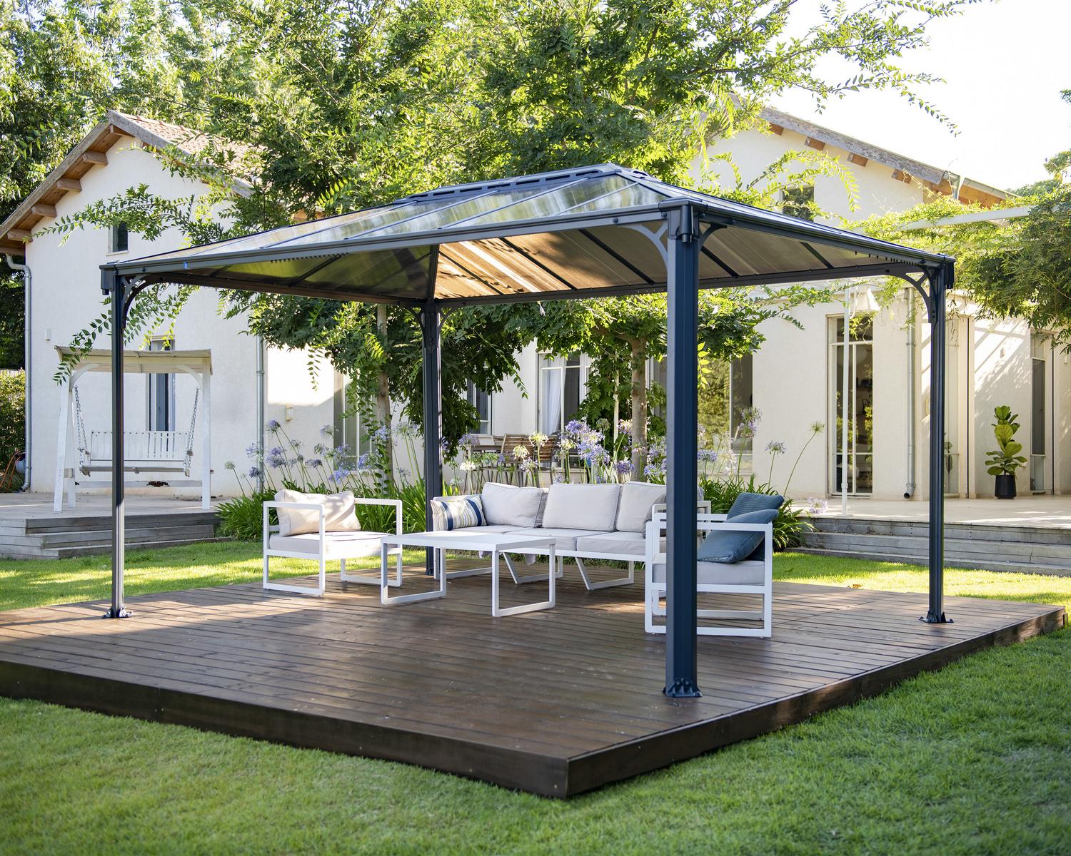 Martinique 3m x 4.3m grey garden gazebo with an aluminum frame and polycarbonate roof panels, set in an outdoor environment