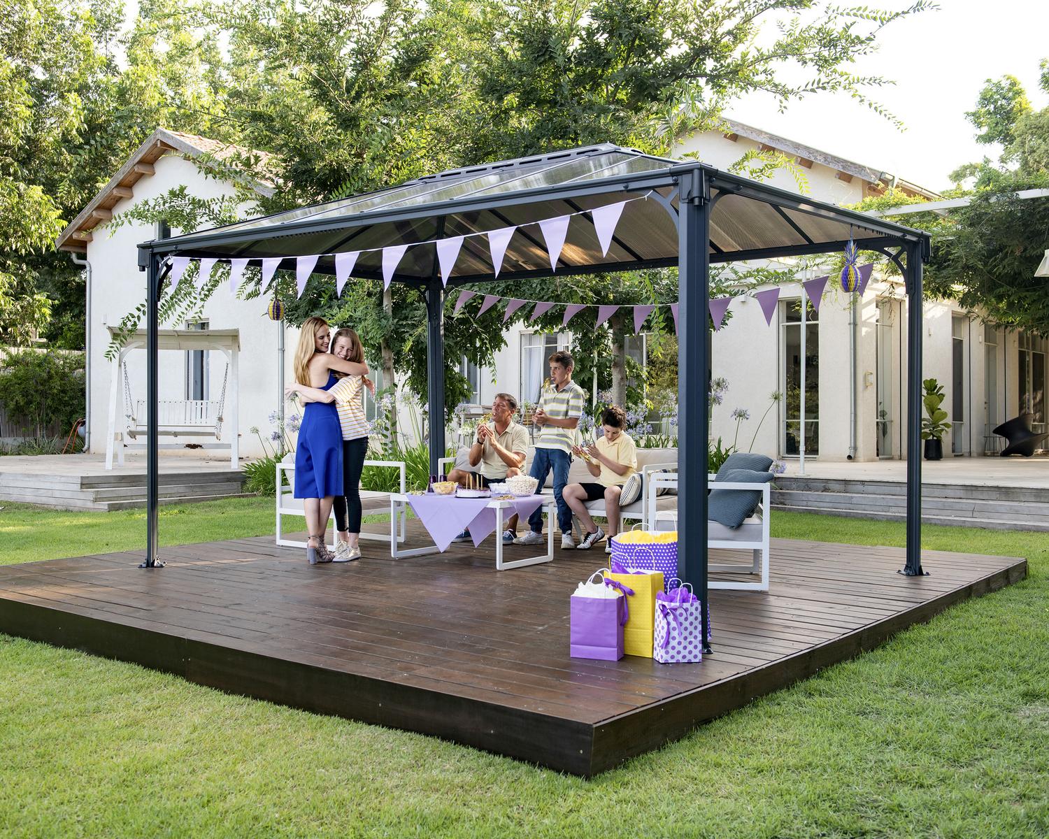 Martinique 3m x 4.3m grey garden gazebo with an aluminum frame and polycarbonate roof panels, set in an outdoor environment
