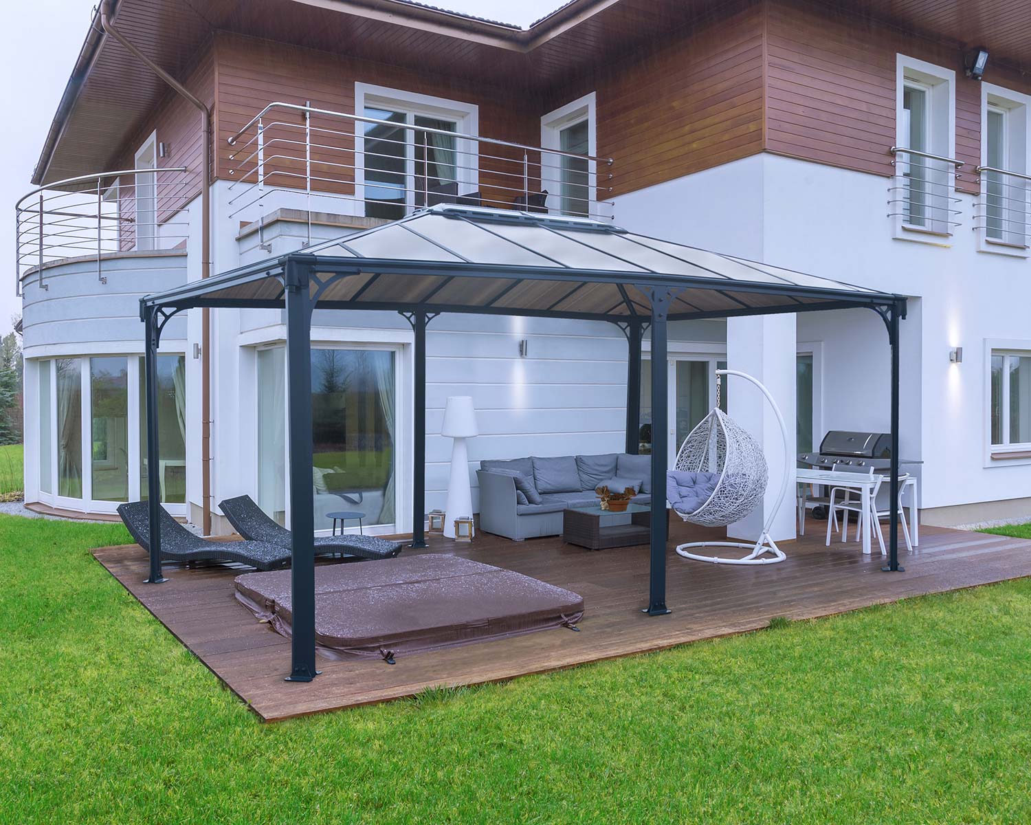 Martinique 3.6m x 5m grey garden gazebo with a sturdy aluminum frame and HeatBlock polycarbonate roof panels, offering spacious and stylish outdoor shelter