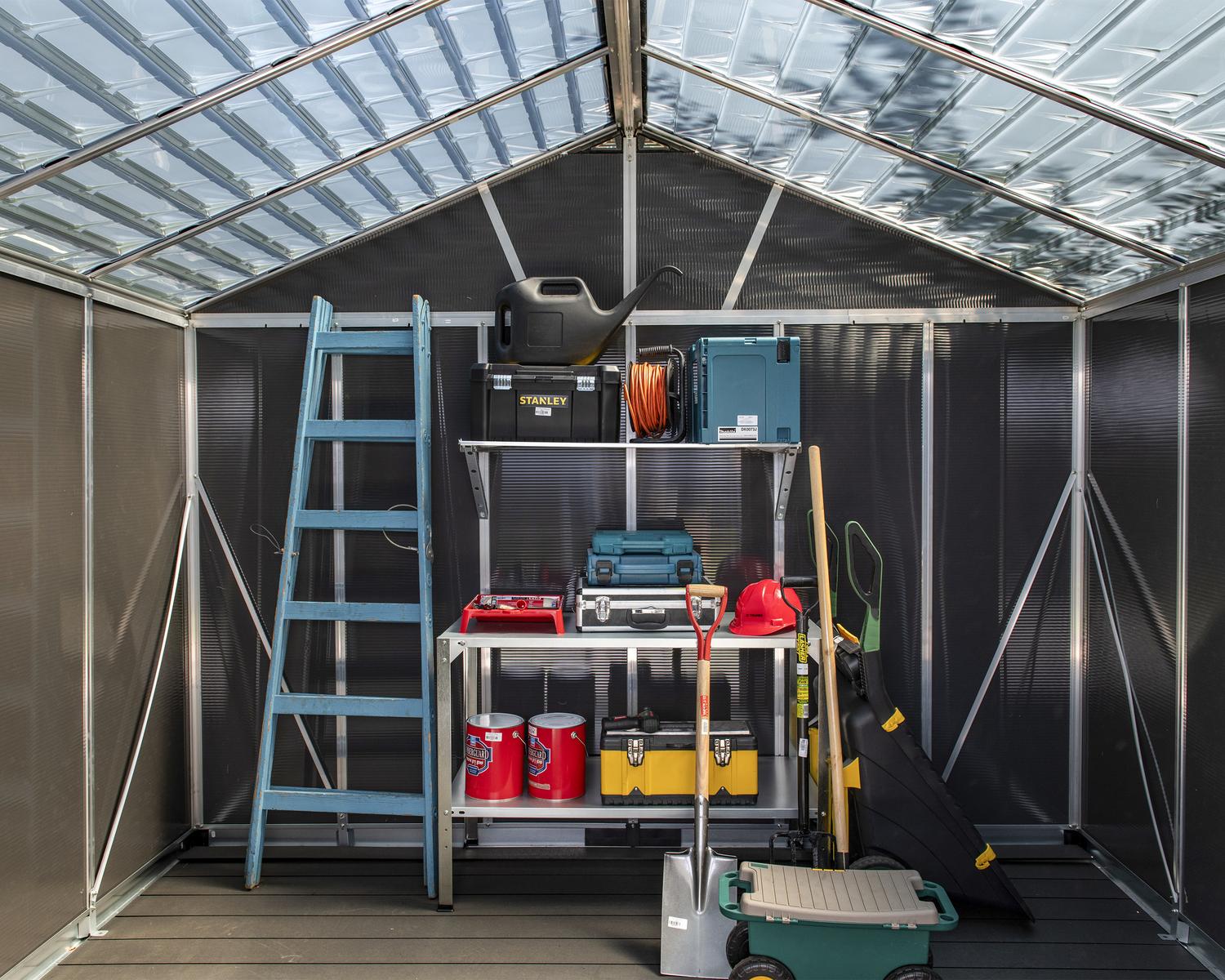 Organizing of tools in large plastic storage shed with a skylight roof