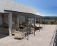 Grey Aluminium Patio Cover With Bronze-tinted twin-wall polycarbonate roof panels on Deck Patio