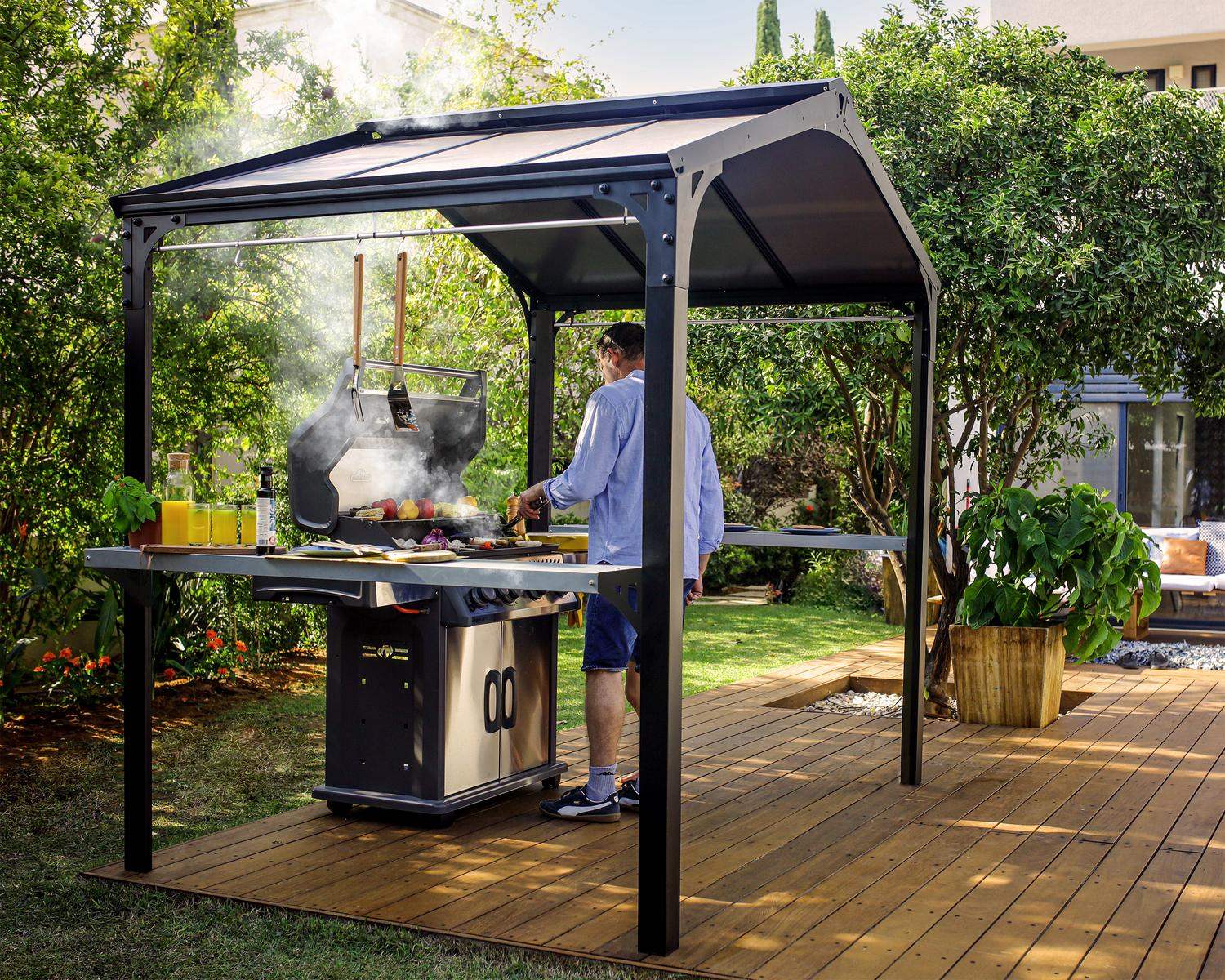 Grill setup under a 1.8m x 2.4m black aluminum Austin gazebo with a HeatBlock polycarbonate roof