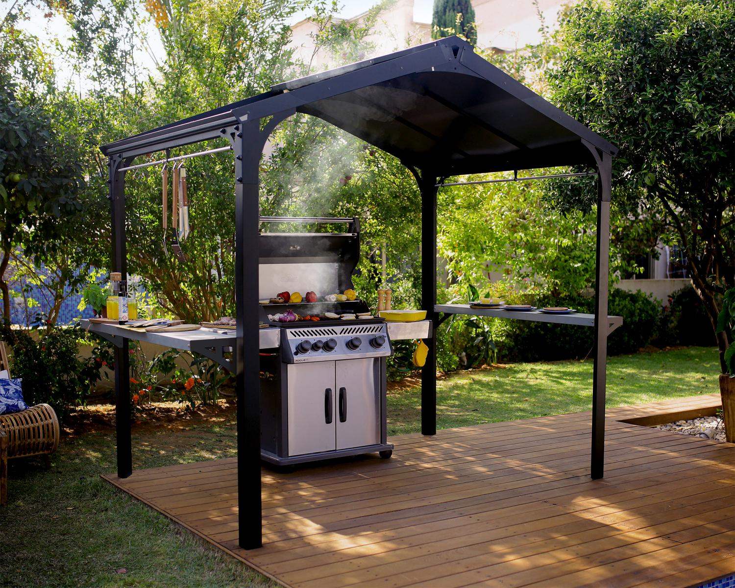 Black 1.8m x 2.4m Austin garden gazebo with a polycarbonate roof and aluminum frame, offering elegant outdoor shelter