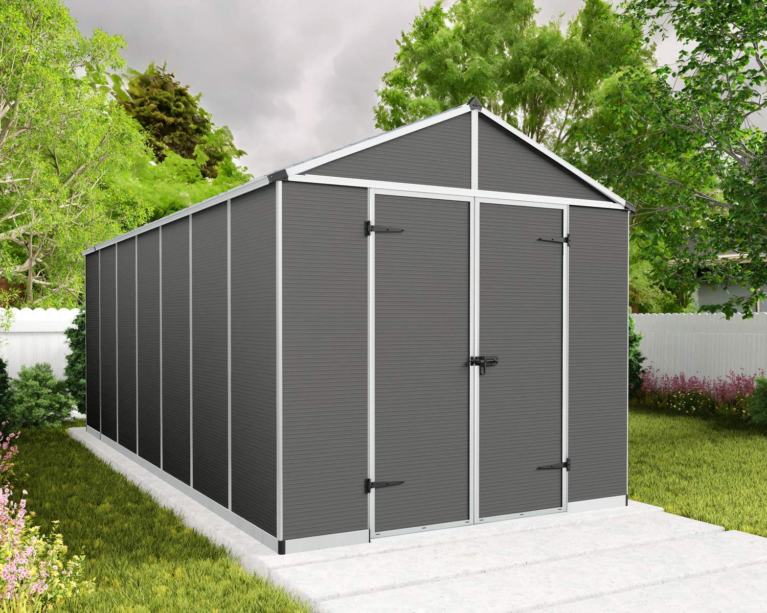 8ft x 17ft grey Rubicon garden shed with an aluminum frame and polycarbonate panels, in a grassy backyard with a wooden fence