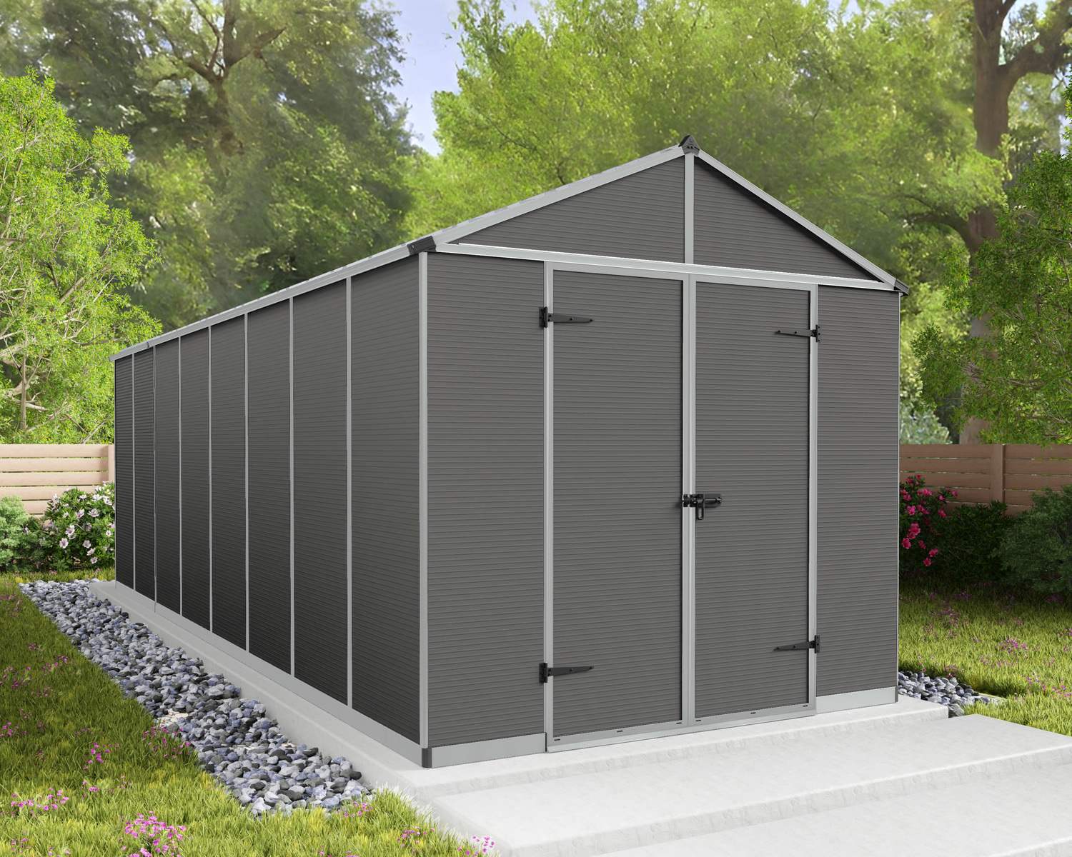 8ft x 20ft grey Rubicon garden shed with an aluminum frame and polycarbonate panels, bordered by a wooden fence and lush greenery