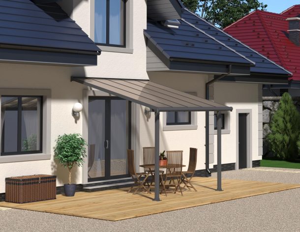 Grey Aluminium Patio Cover With Bronze-tinted twin-wall polycarbonate roof panels on Deck Patio protect garden furniture 