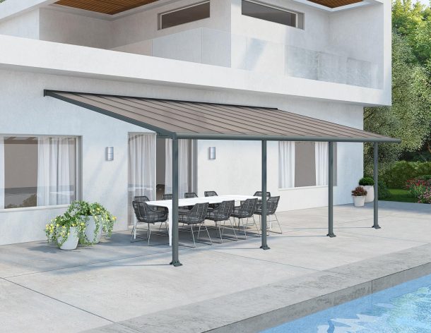 Grey Aluminium Patio Cover With Bronze-tinted twin-wall polycarbonate roof panels on Beside Pool Patio protect garden furniture 